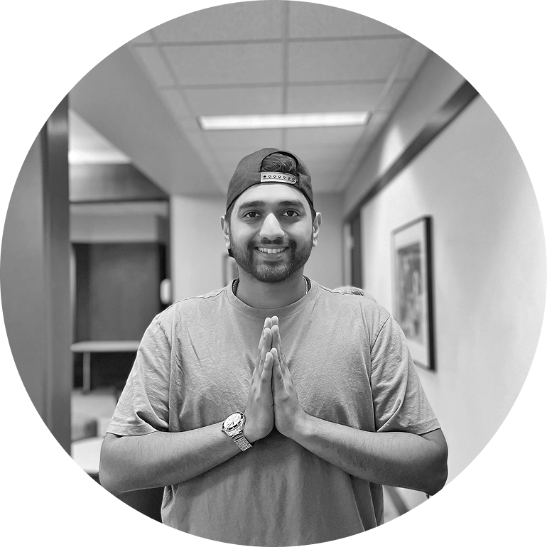 Sumeet Gokhale in a hallway, hands together in a namaste.