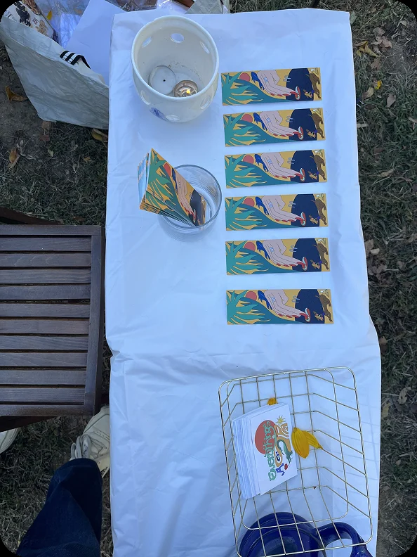 Prints laid out on a market table.